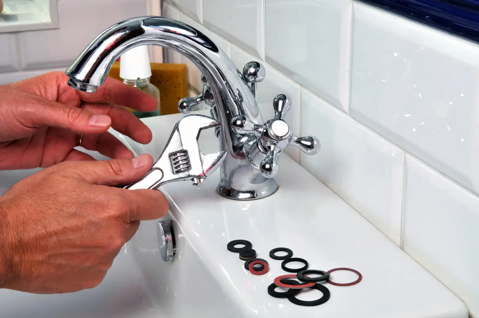 Plumber maintaining a bathroom faucet in Hayward