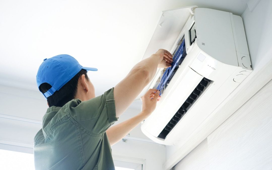 HVAC technician servicing a ductless mini split in Hayward