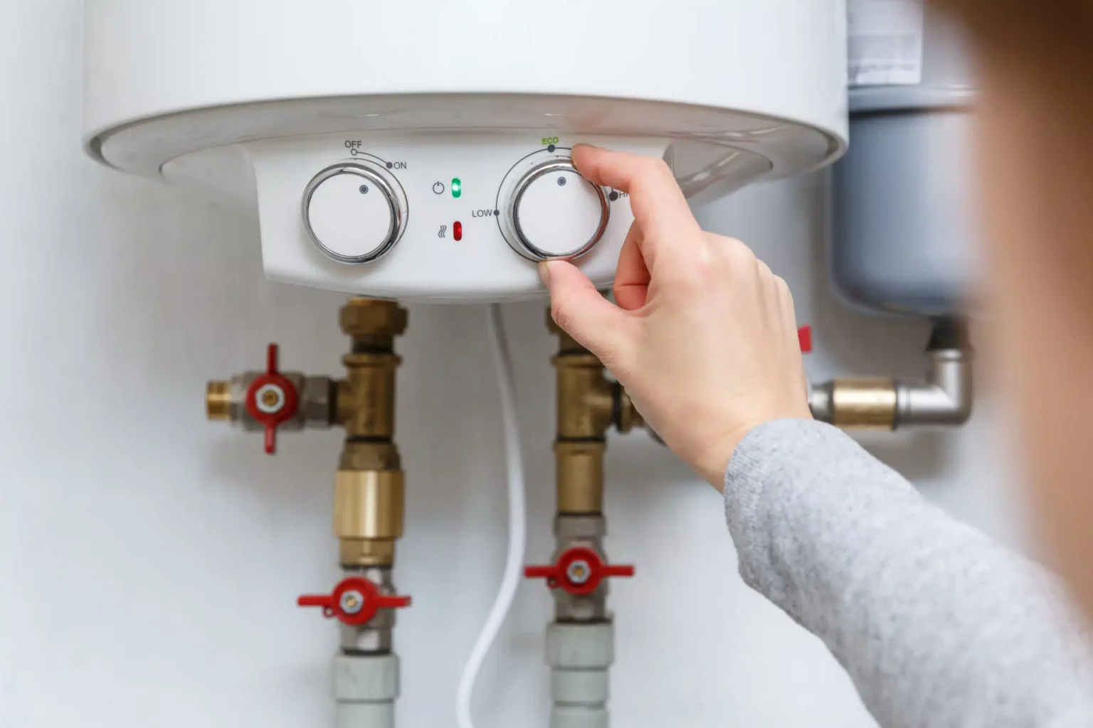 Technician adjusting a water heater in Hayward